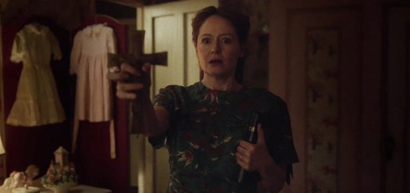 Miranda Otto tries to ward off demons in ANNABELLE: CREATION.