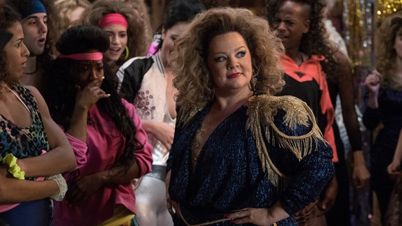 Melissa McCarthy wearing a ridiculous sparkly 80s outfit at an 80s dance off in Life of the Party.