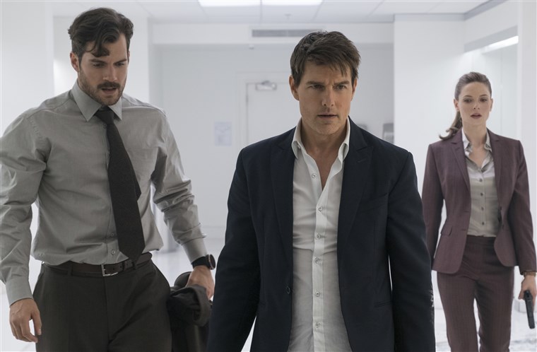 Henry Cavill, Tom Cruise, and Rebecca Ferguson looking exhausted, recover from a bathroom fight scene in MISSION: Impossible - Fallout.