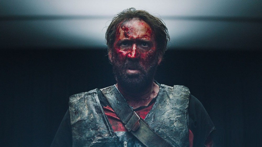 Nicholas Cage looking angry, covered in dried blood in the film Mandy