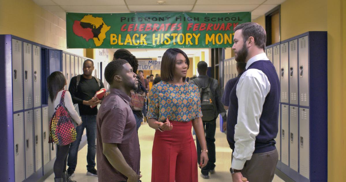 Kevin Hart and Tiffany Haddish standing in a high school hallway talking to Taran Killam in the movie Night School.