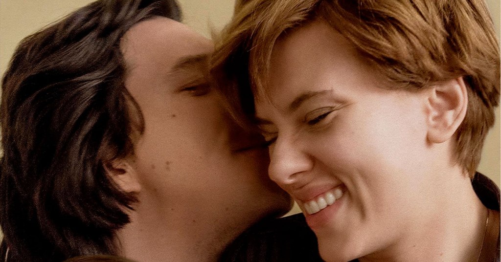 Adam Driver kisses Scarlett Johansson on the cheek while she laughs with her eyes closed in the movie Marriage Story