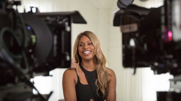 Laverne Cox in front of cameras sitting between them being interviewed in the documentary Disclosure