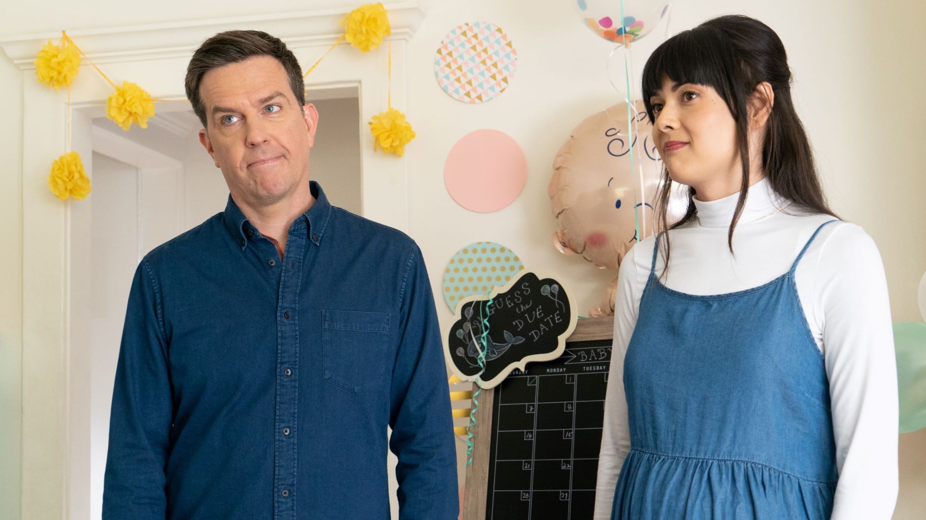 Ed Helms and Patti Harrison stand together in the movie Together Together