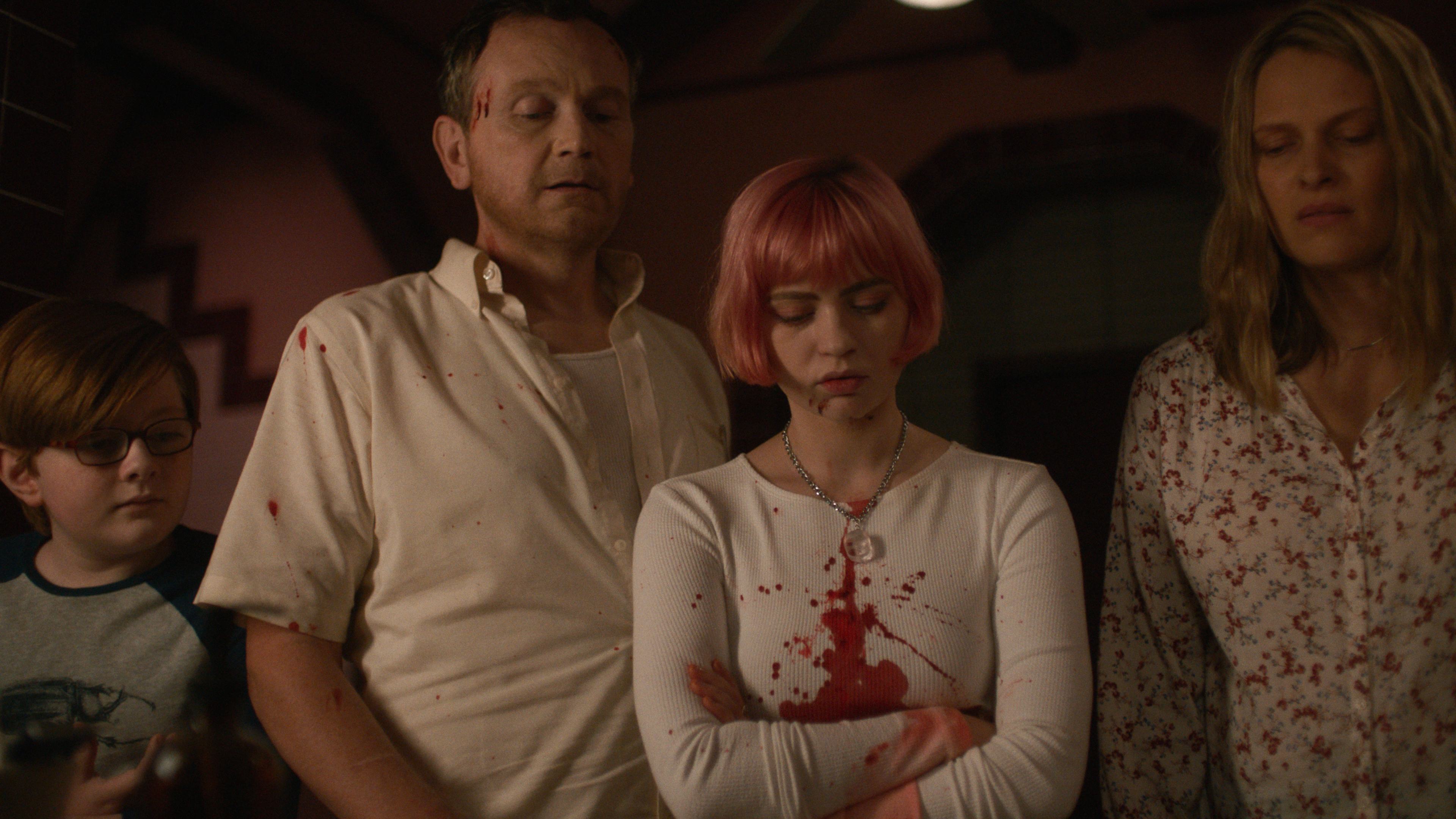 John James Cronin, Pat Healy, Sierra McCormick, and Vinessa Shaw stand next to each other covered in blood and looking down at something disgusting in the movie We Need to Do Something.