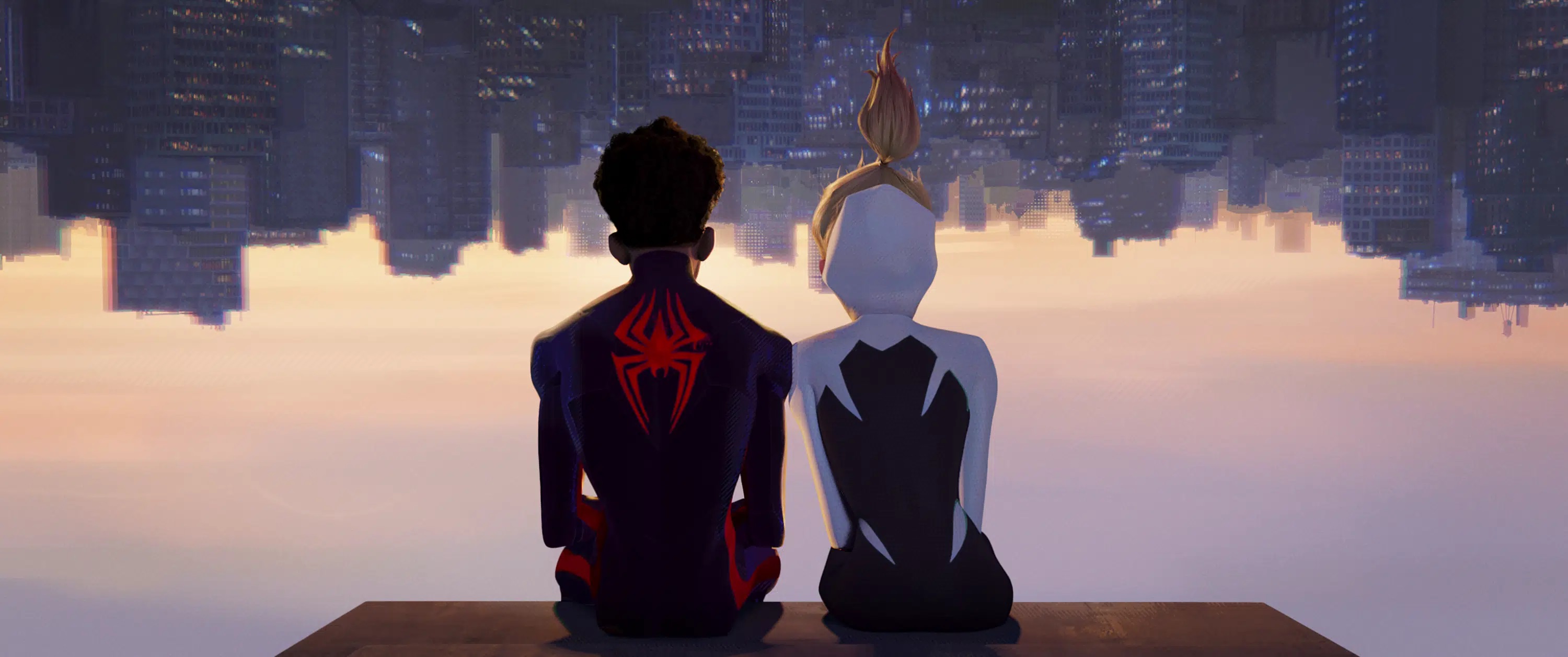 Miles Morales and Gwen Stacy sit on a ledge together in Spider-Man: Across the Spiderverse.
